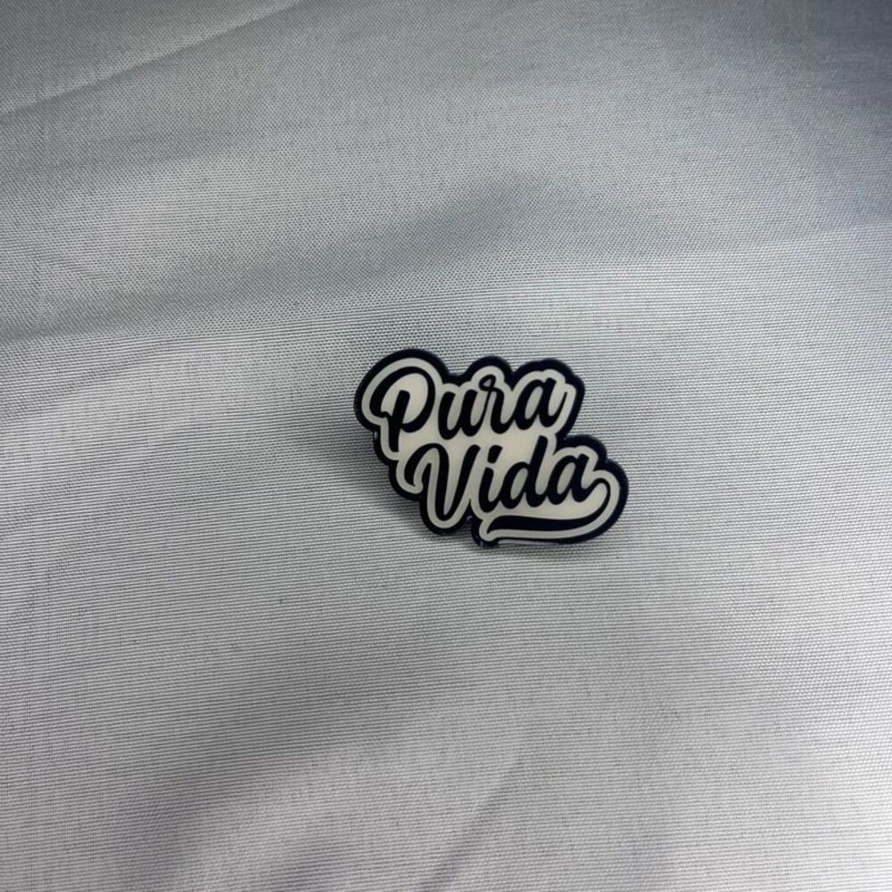White "Pura Vida" Script Pinback Button - Black Outline, Cursive Font